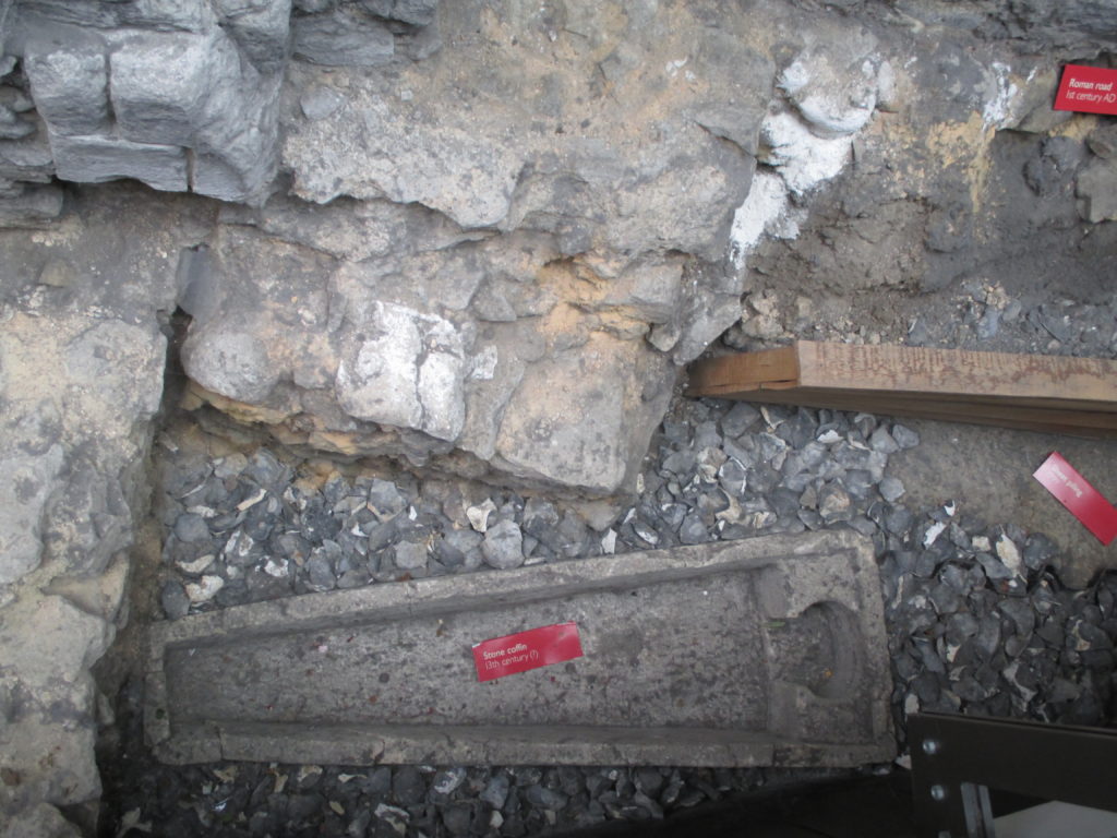 13th Century Stone Coffin unearthed during renovations to the church. On the upper right is a Roman Road from the 1st Century AD