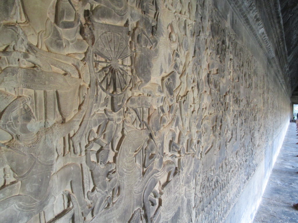 The entire wall is carved with stories from history.